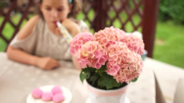 Lonely Birthday. A Sad, Well-dressed Birthday Girl Sits Alone at the Table and Cries Because No One