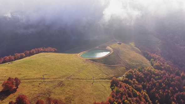 Aerial View of Artificial Lake in Mountains Generating Sustainable Development and Environment
