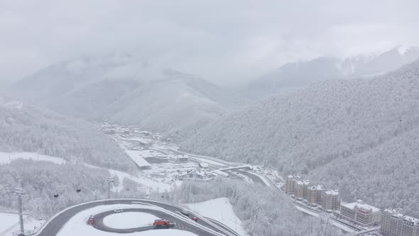 Slowly Flight Aerial View at Ski Resort for Extreme Sport Vacation Leisure Activity Alpine Mountain