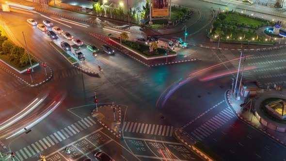 Time lapse of aerial view of intersection or junction with cars traffic, Bangkok Downtown. Thailand.