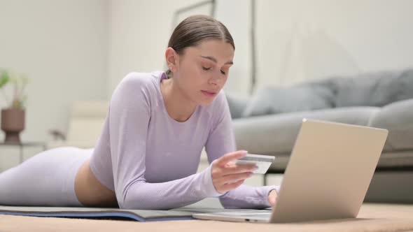 Latin Woman Making Online Payment on Laptop on Yoga Mat