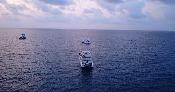 Natural drone clean view of a white paradise beach and aqua blue ocean background in colourful 