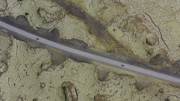 Aerial view of car driving on road in Iceland.