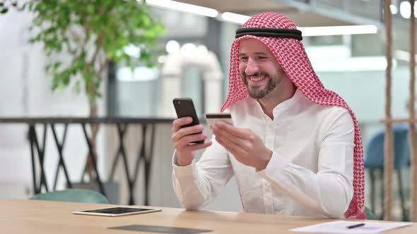 Arab Businessman with Successful Online Payment on Smartphone