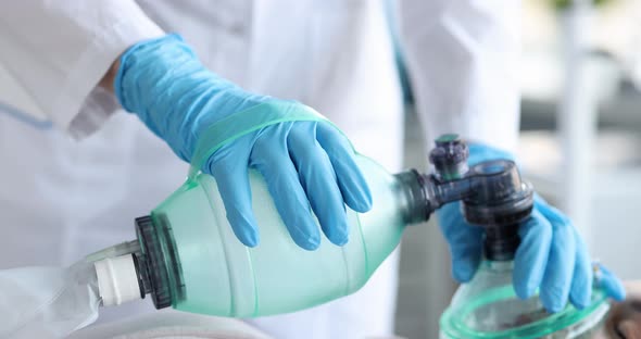 Doctor Holding an Oxygen Mask of Patient in Emergency Room