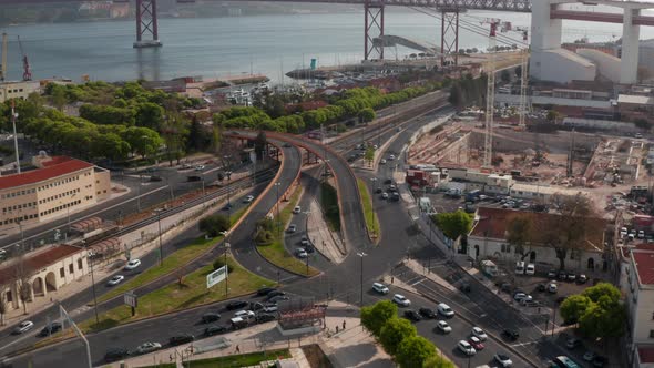 Cars Driving on the Road in a Busy Intersection By the Shoreline of Portugal Coast in Lisbon