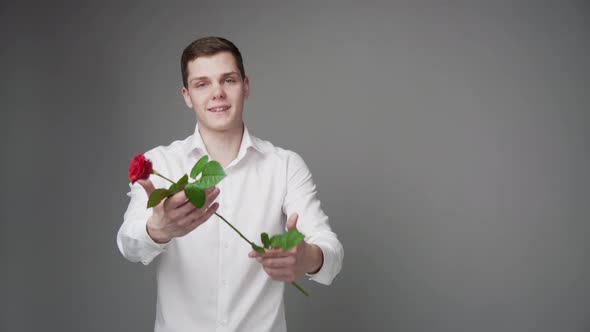 The Guy Offers to Take a Beautiful Rose From Him