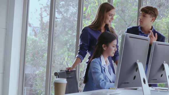 Happy Businesswoman and Businessman Having Conversation in Modern Office