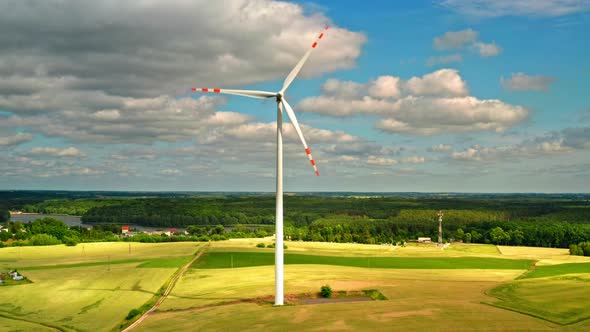 Wind turbines on green field in Poland, view from above