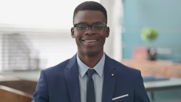 Young African Businessman Smiling at Camera