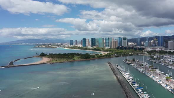 Wide dolly aerial shot of Magic Beach in Honolulu, Hawaii. 4K