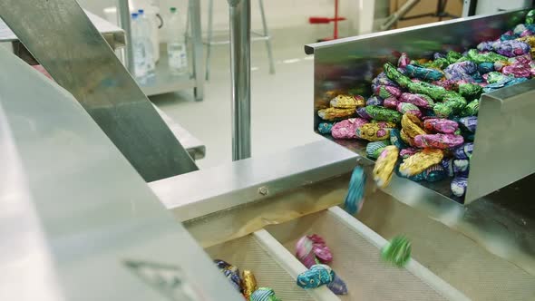 Sweets Spilling From Conveyor. Candy Factory.