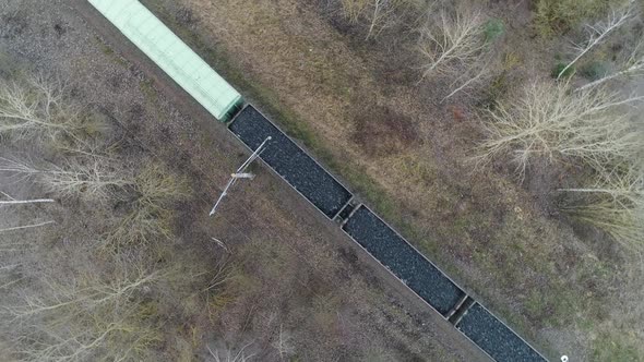 Countryside Freight Train Ride on Railroad Transports Gravel in Containers View From Height