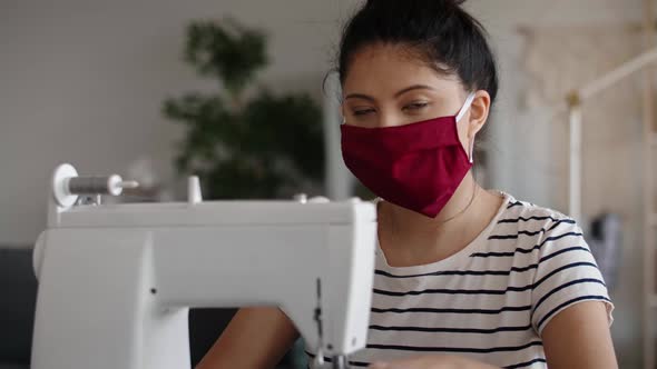 Portrait handheld video of Asian woman in a protective mask