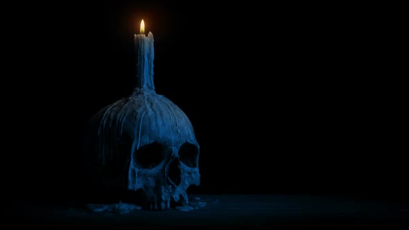 Old Skull With Candle At Night