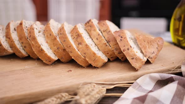 Sliced Fresh Bread on Wooden Cutting Board