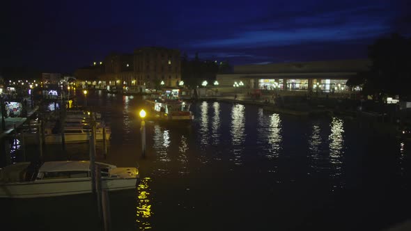Vaporetto Water Taxi Taking Tourists to Hotel at Night, Transport in Venice