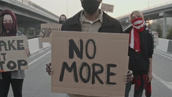 Masked Young People Protesting on Highway