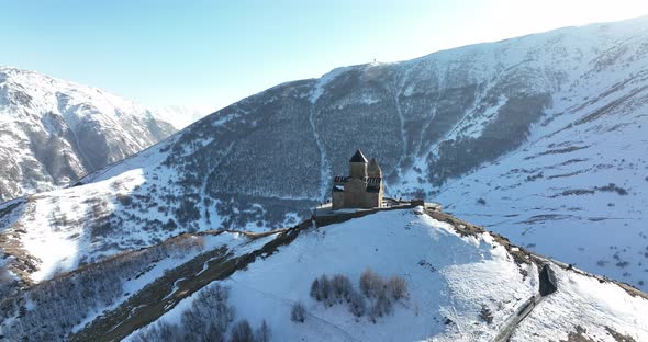 Aerial view of Gergeti Trinity Church, Tsminda Sameba in Kazbegi. Georgia 2022