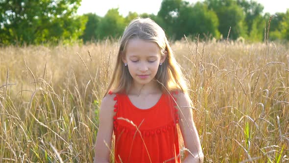 Beautiful Little Blonde Girl, Has Happy Fun Cheerful Smiling Face, Red Dress