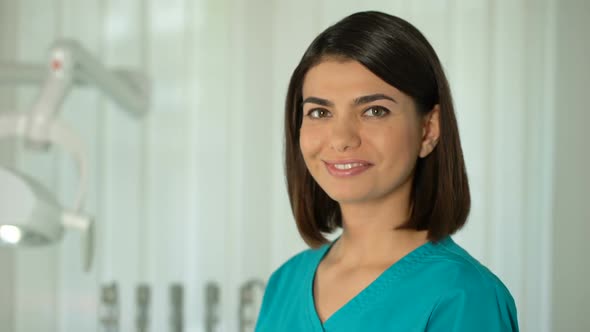 Charming Female Doctor Posing for Camera, Confidence and Professionalism, Clinic