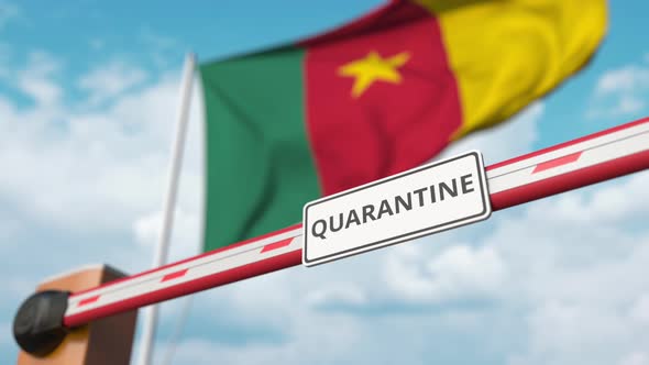 Open Gate with QUARANTINE Sign at the Cameroonian Flag alt
