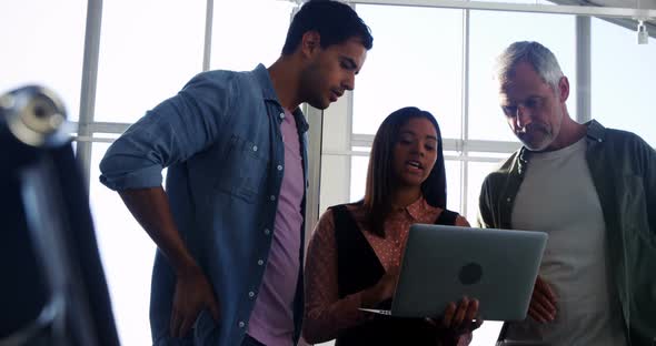 Business colleagues discussing over laptop in the meeting 4k