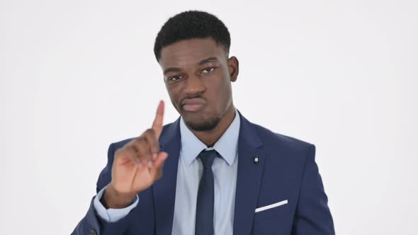 African Businessman Showing No Sign By Finger on White Background