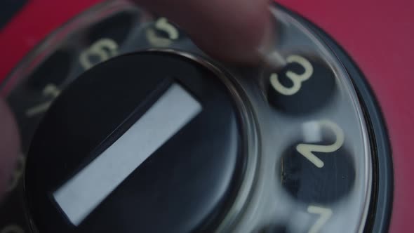 Close-up view of a hand picking up the telephone