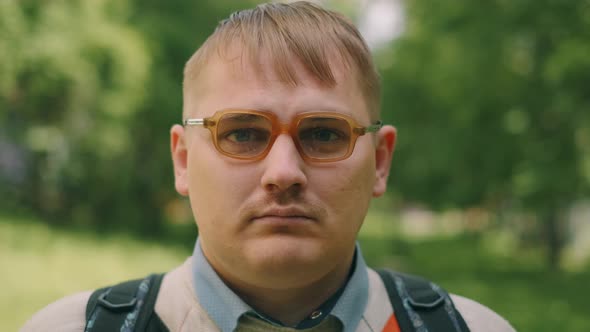 Portrait of Serious Nerdy Man in Glasses