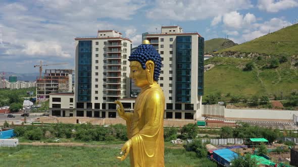 Aerial Around View of Big Golden Buddha Statue