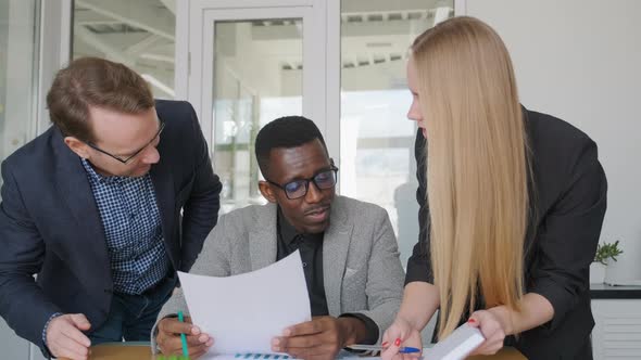 Diverse Business Team African Man Has Argument with His Caucasian Colleagues