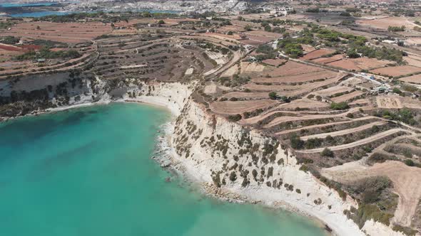 Aerial drone video from eastern Malta, Marsaxlokk area, Il-Hofra l-Kbira bay.