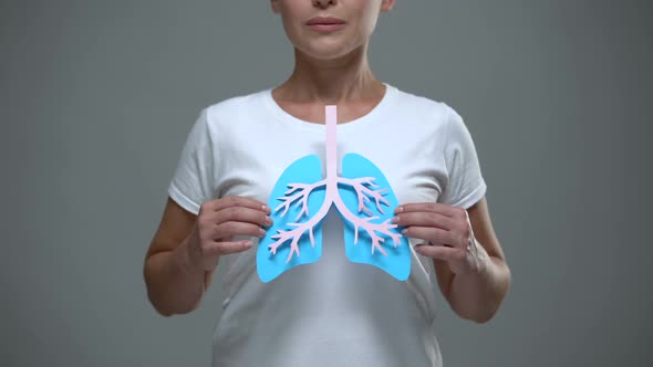 Lady Holding Paper Lungs Sign, Prevention of Cancer and Tuberculosis, Healthcare