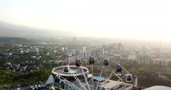 Ferris Wheel on the Green Hill Kok Tobe at Sunset