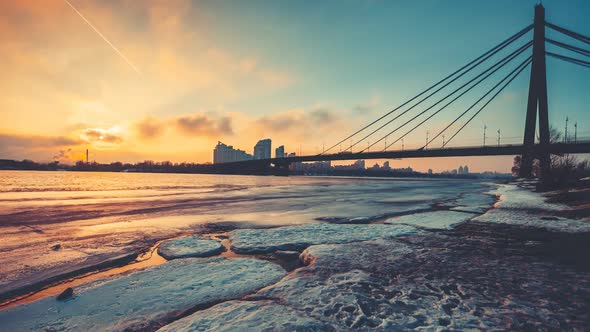 Pivnichnyi Bridge Silhouette Over Half Frozen Dnipro River