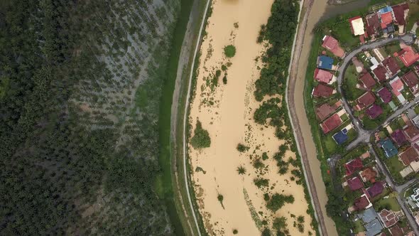 Aerial view river flood and cause oil palm plantation