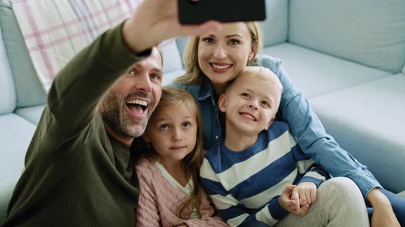 Family making a selfie in living room