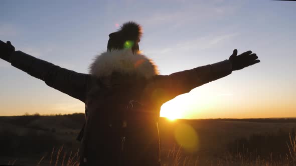 Happy Traveler Girl with a Successful Emotion By Raise Two Arms Over Her Head. Cheering Successful