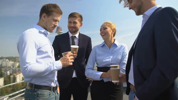 Happy Colleagues With Coffee Cups Talking Office Terrace Enjoying Work Break