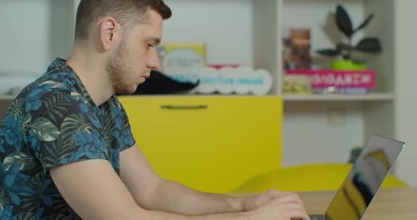 Man Freelancer Using Laptop Online Working in Internet, Guy Typing on Computer Surfing Web Looking