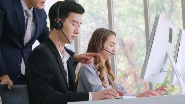 Business People Wearing Headset Working in Office