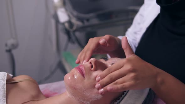 Young Woman Getting a Professional Peeling in Spa Salon