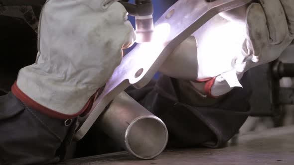 Welding Process. Worker Doing Welding Job. A Man Doing Argon Welding Parts