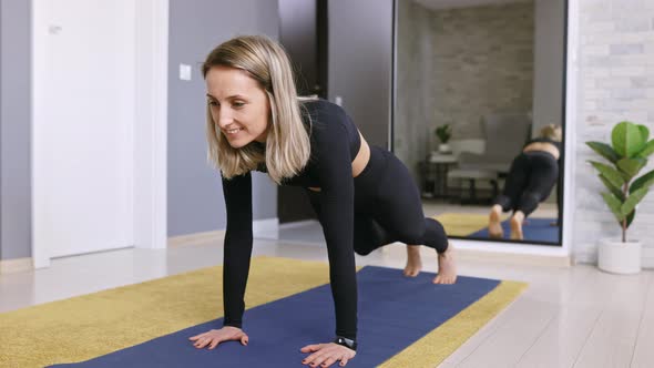 Happy Fit Woman Exercising at Home in Sportswear