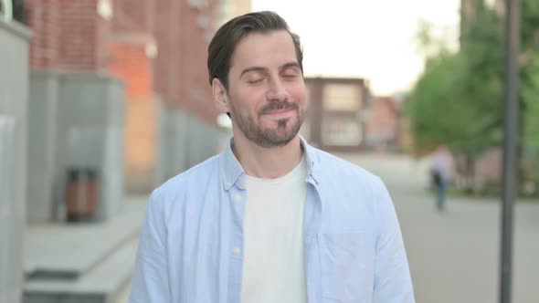 Agree Man Shaking Head While Standing Outdoor