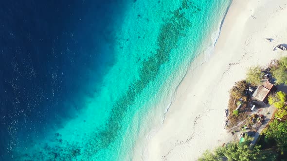 Aerial scenery of marine lagoon beach vacation by aqua blue lagoon and white sand background of a da