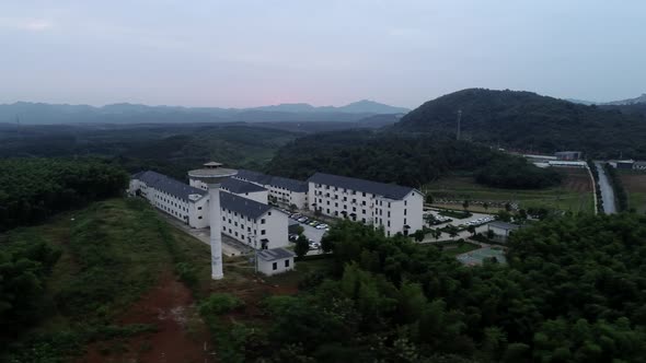 Aerial Photography Of Sporadic Houses In  Mountains In Morning Lens Moves Left