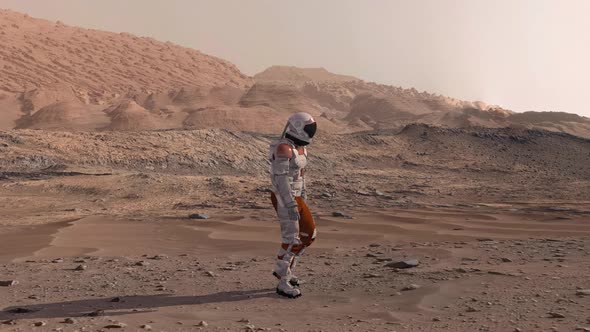 Astronaut Wearing Space Suit Walking on the Surface of Mars. Exploring Mission To Mars. Futuristic alt