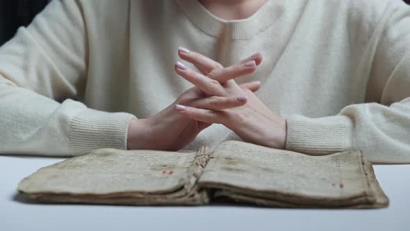 Unrecognizable Woman Reading Old Ancient Book  Holy Bible and Praying
